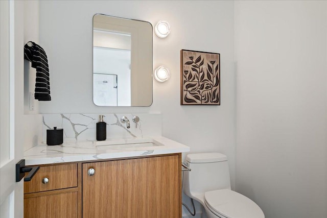 13400 Paisano Trl, Austin, TX 78737 - bathroom featuring toilet, vanity, and decorative backsplash