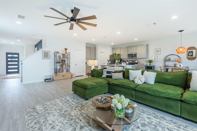 12305 Zenyatta Dr, Buda, TX 78610 - living area featuring ceiling fan, recessed lighting, and light wood-style flooring