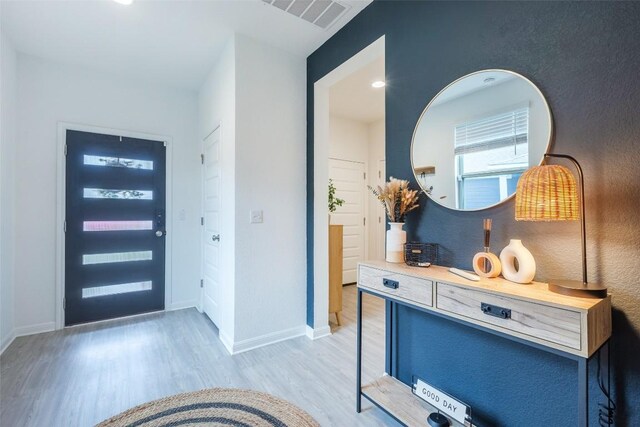 12305 Zenyatta Dr, Buda, TX 78610 - foyer featuring baseboards, light wood finished floors, and visible vents