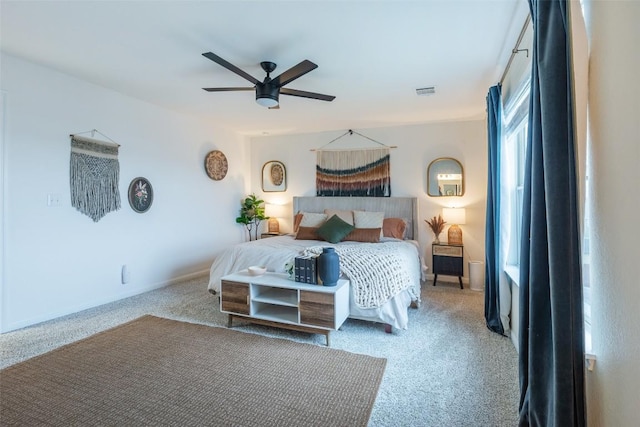 bedroom featuring visible vents, carpet flooring, and ceiling fan