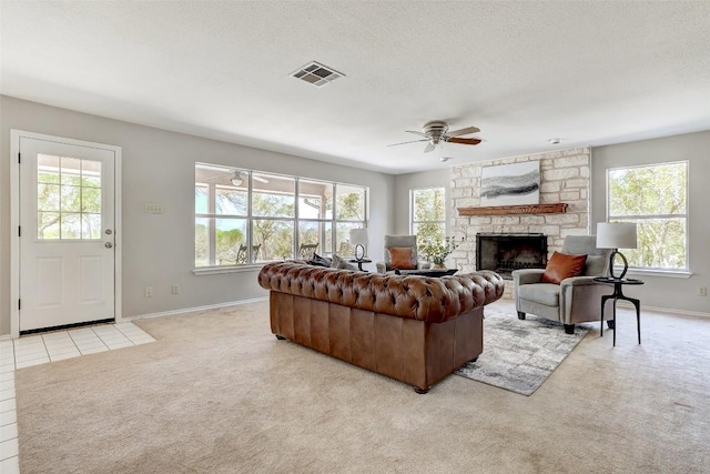 591 Young Ranch Rd, Georgetown, TX 78633 - living area featuring healthy amount of natural light, a ceiling fan, and a textured ceiling