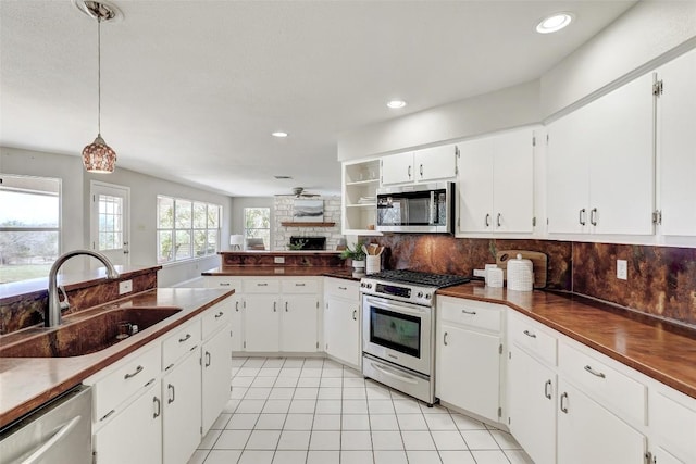 591 Young Ranch Rd, Georgetown, TX 78633 - kitchen featuring appliances with stainless steel finishes, a sink, dark countertops, backsplash, and recessed lighting