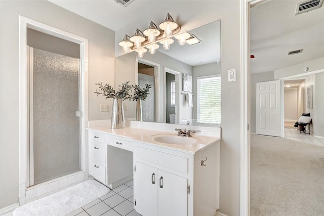 591 Young Ranch Rd, Georgetown, TX 78633 - bathroom with tile patterned flooring, vanity, a stall shower, and toilet
