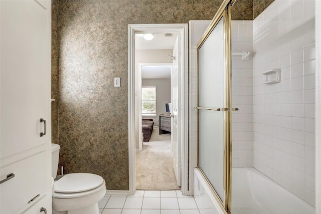 591 Young Ranch Rd, Georgetown, TX 78633 - full bath with tile patterned floors, enclosed tub / shower combo, and toilet