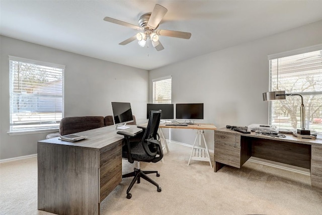 591 Young Ranch Rd, Georgetown, TX 78633 - home office with light colored carpet, baseboards, and plenty of natural light