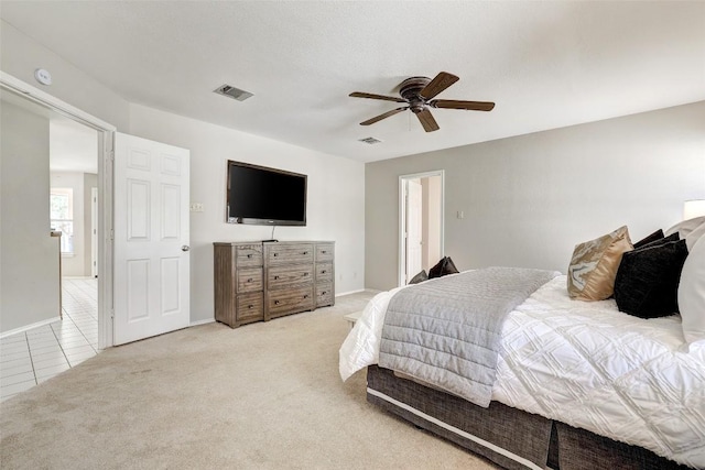 591 Young Ranch Rd, Georgetown, TX 78633 - tiled bedroom featuring carpet, baseboards, and a ceiling fan