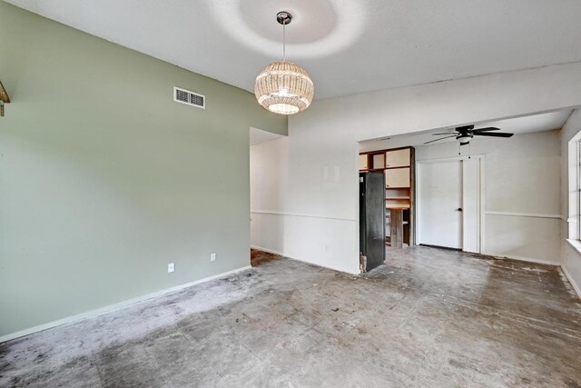 2511 Bitter Creek Dr, Austin, TX 78744 - unfurnished room featuring a chandelier, concrete floors, a ceiling fan, and baseboards