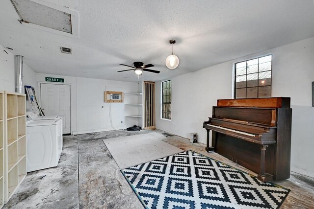 2511 Bitter Creek Dr, Austin, TX 78744 - living area featuring washer / clothes dryer, a ceiling fan, and a textured ceiling