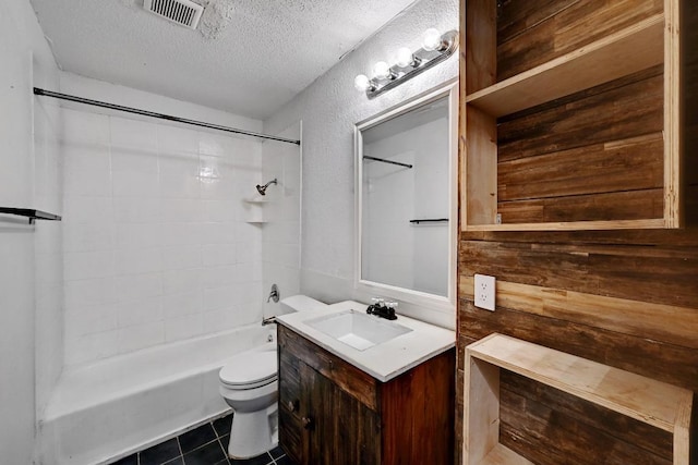 2511 Bitter Creek Dr, Austin, TX 78744 - bathroom with a textured ceiling, vanity, shower / bath combination, toilet, and tile patterned flooring