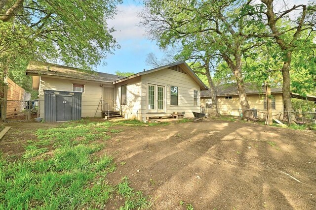 2511 Bitter Creek Dr, Austin, TX 78744 - rear view of property with entry steps