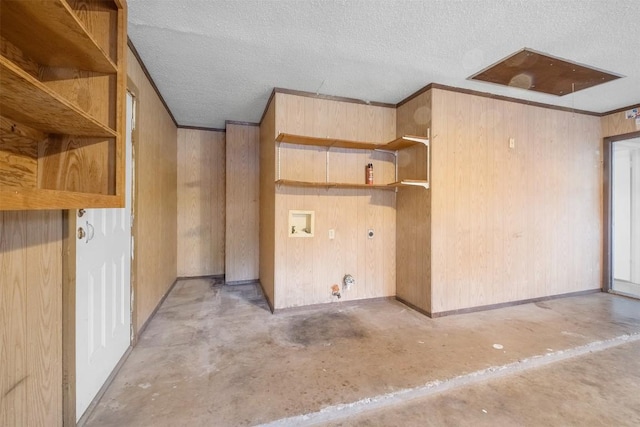 12503 Brandywine Ct, Austin, TX 78727 - empty room featuring unfinished concrete floors, a textured ceiling, wood walls, and crown molding