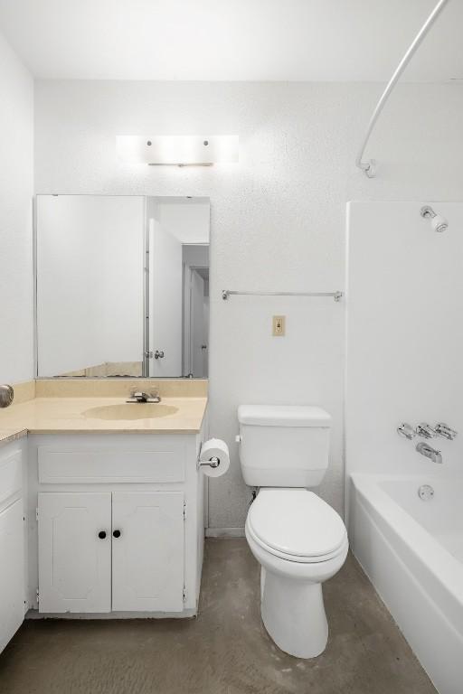 12503 Brandywine Ct, Austin, TX 78727 - bathroom with vanity, toilet, shower / bath combination, and concrete flooring