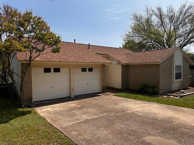 12503 Brandywine Ct, Austin, TX 78727 - single story home with brick siding, concrete driveway, an attached garage, and roof with shingles