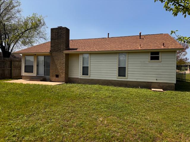 12503 Brandywine Ct, Austin, TX 78727 - back of house featuring a chimney and a patio area