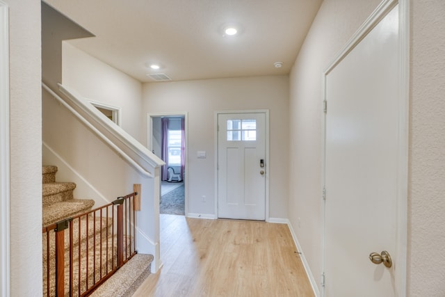 312 Heatherwood Ter, Marble Falls, TX 78654 - foyer entrance featuring stairs, light wood finished floors, baseboards, visible vents, and recessed lighting