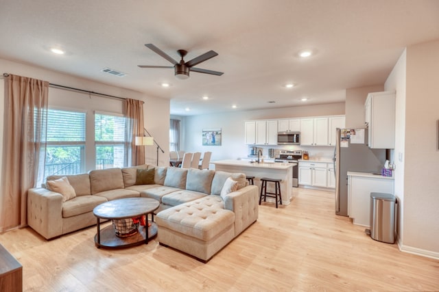 312 Heatherwood Ter, Marble Falls, TX 78654 - living room with a ceiling fan, recessed lighting, light wood-style flooring, and visible vents