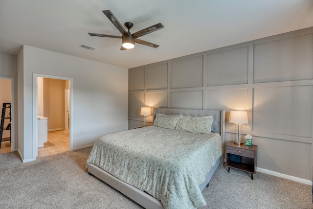 312 Heatherwood Ter, Marble Falls, TX 78654 - bedroom with a decorative wall, light carpet, and visible vents