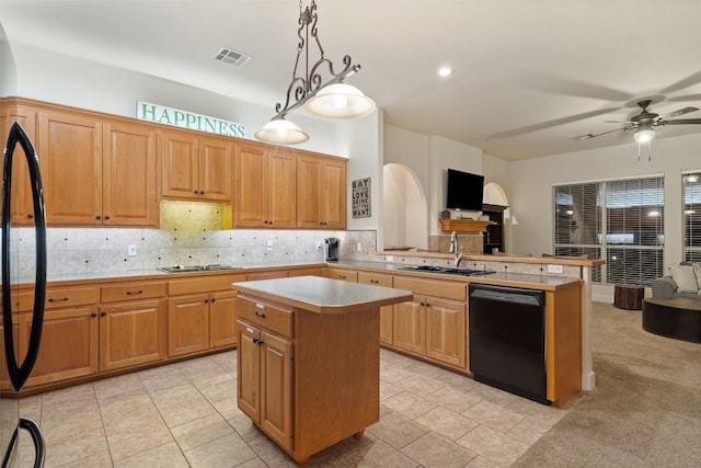 510 N Horseshoe Bay Blvd, Horseshoe Bay, TX 78657 - kitchen with black appliances, a sink, open floor plan, tasteful backsplash, and a center island