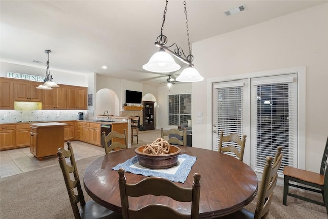 510 N Horseshoe Bay Blvd, Horseshoe Bay, TX 78657 - dining area with a ceiling fan, light carpet, and light tile patterned floors