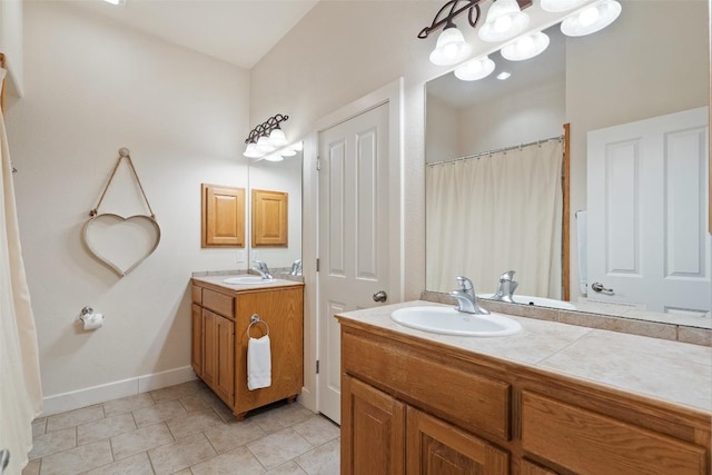 510 N Horseshoe Bay Blvd, Horseshoe Bay, TX 78657 - full bathroom featuring vanity, tile patterned flooring, and baseboards