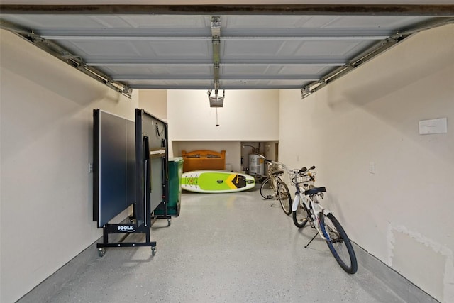 510 N Horseshoe Bay Blvd, Horseshoe Bay, TX 78657 - garage featuring a garage door opener and water heater