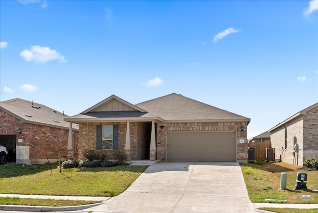 ranch-style house with driveway, central air condition unit, brick siding, a front lawn, and a garage