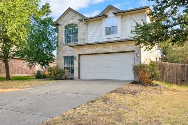16101 Mcdows Hole Ln, Austin, TX 78717 - traditional-style home featuring stone siding, a garage, and driveway