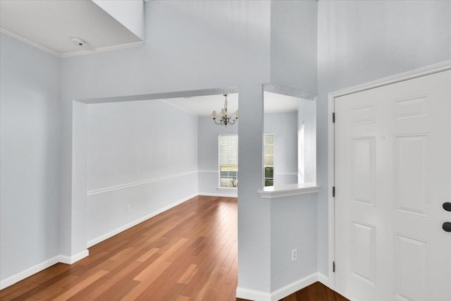 16101 Mcdows Hole Ln, Austin, TX 78717 - foyer entrance featuring a chandelier, wood finished floors, baseboards, and ornamental molding