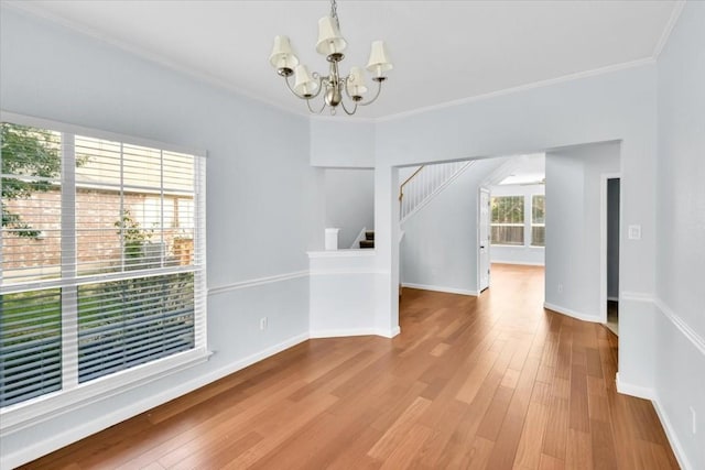 16101 Mcdows Hole Ln, Austin, TX 78717 - unfurnished dining area featuring a chandelier, stairs, ornamental molding, wood finished floors, and baseboards