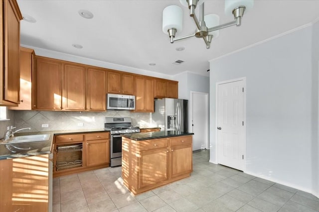 16101 Mcdows Hole Ln, Austin, TX 78717 - kitchen with stainless steel appliances, a center island, backsplash, light tile patterned floors, and crown molding