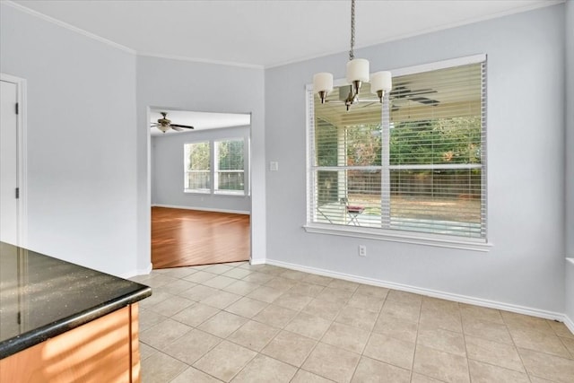 16101 Mcdows Hole Ln, Austin, TX 78717 - unfurnished dining area with crown molding, a chandelier, light tile patterned flooring, and a ceiling fan