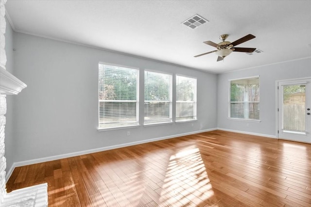 16101 Mcdows Hole Ln, Austin, TX 78717 - spare room featuring a ceiling fan, baseboards, wood finished floors, and ornamental molding