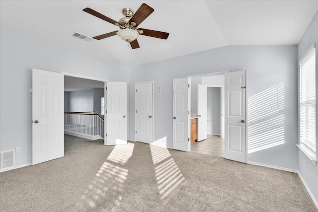 16101 Mcdows Hole Ln, Austin, TX 78717 - unfurnished bedroom with light colored carpet, a ceiling fan, and vaulted ceiling