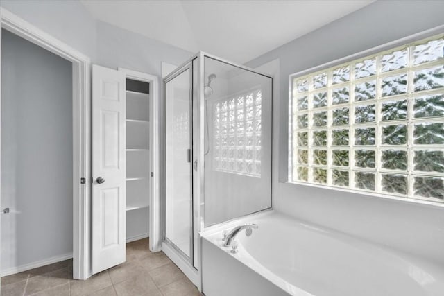 16101 Mcdows Hole Ln, Austin, TX 78717 - bathroom featuring a stall shower, a garden tub, and tile patterned flooring