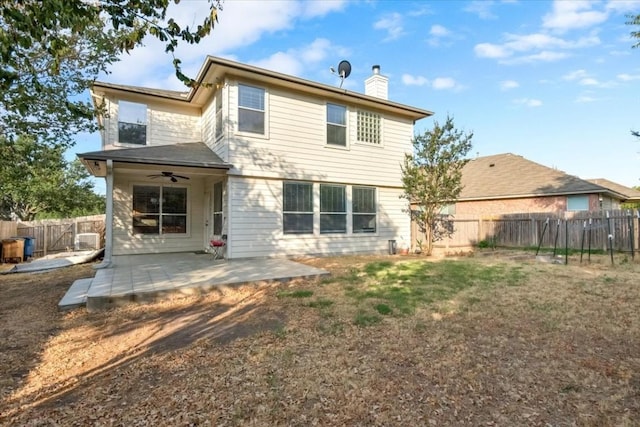16101 Mcdows Hole Ln, Austin, TX 78717 - back of property with ceiling fan, a chimney, a patio, and a fenced backyard