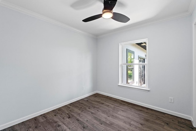 empty room with a ceiling fan, dark wood-style flooring, crown molding, and baseboards
