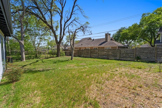 view of yard with a fenced backyard