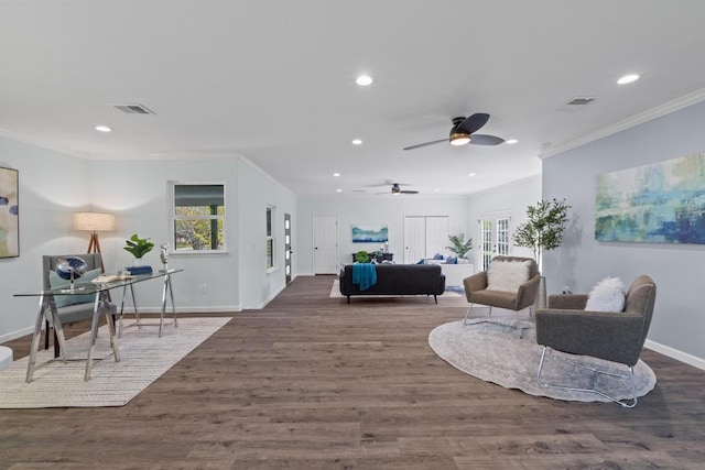 living room featuring visible vents, wood finished floors, and plenty of natural light