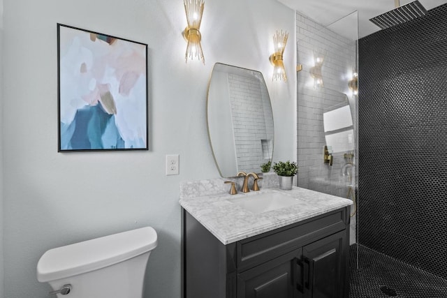 bathroom with toilet, a walk in shower, and vanity