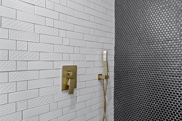 bathroom with tiled shower