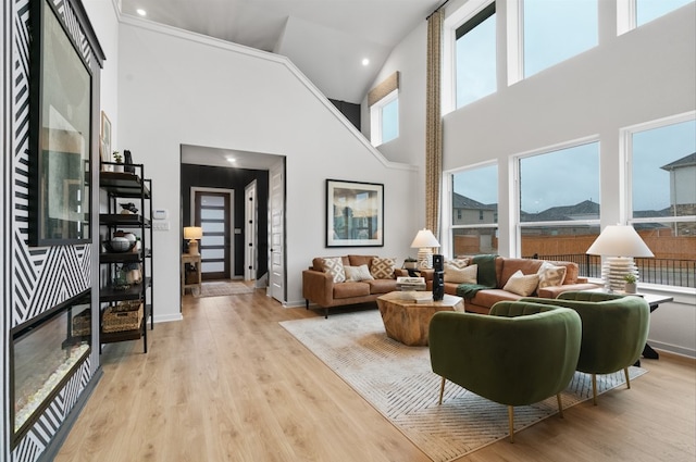 2705 Sage Ranch Dr Unit 32, Leander, TX 78641 - living area with a towering ceiling, wood finished floors, baseboards, and recessed lighting