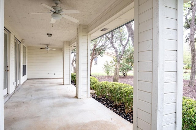 view of patio with a ceiling fan and visible vents