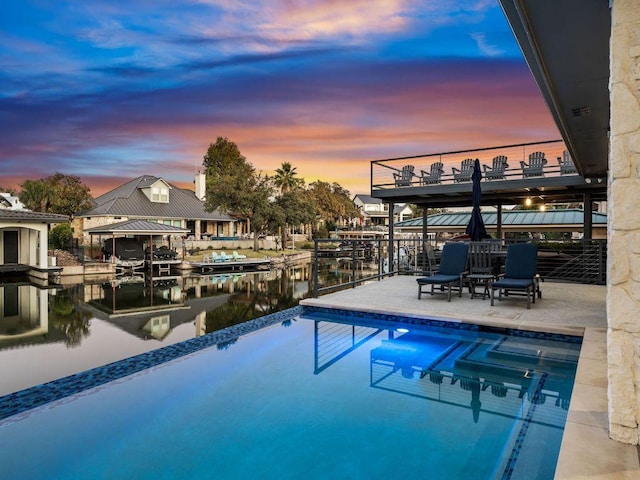 103 Waters Edge, Horseshoe Bay, TX 78657 - swimming pool with boat lift, a water view, and a boat dock