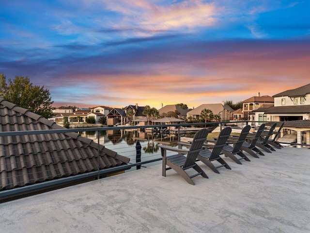 103 Waters Edge, Horseshoe Bay, TX 78657 - patio terrace at dusk with a residential view