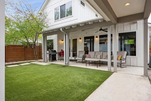 1506 Payne Ave Unit A, Austin, TX 78757 - rear view of property featuring board and batten siding, a patio, an outdoor living space, and ceiling fan
