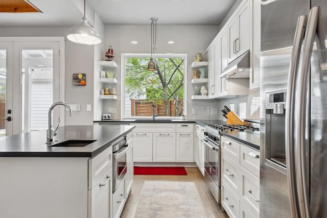 1506 Payne Ave Unit A, Austin, TX 78757 - kitchen featuring appliances with stainless steel finishes, open shelves, under cabinet range hood, and a sink