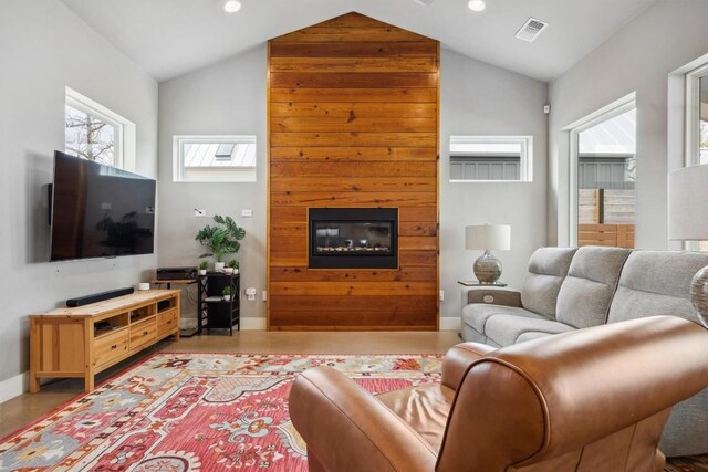 1506 Payne Ave Unit A, Austin, TX 78757 - living room with a large fireplace, baseboards, high vaulted ceiling, and recessed lighting