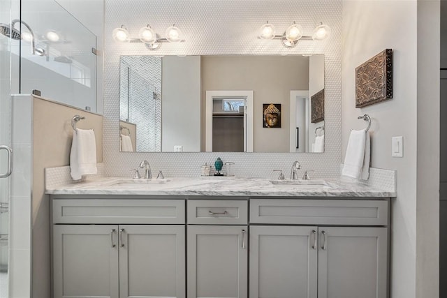 2514 E 4th St Unit A, Austin, TX 78702 - bathroom featuring a stall shower, double vanity, and backsplash