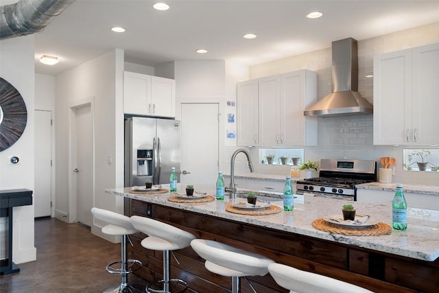2514 E 4th St Unit A, Austin, TX 78702 - kitchen with appliances with stainless steel finishes, wall chimney exhaust hood, finished concrete floors, decorative backsplash, and recessed lighting