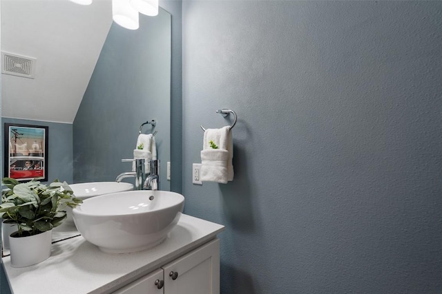 2514 E 4th St Unit A, Austin, TX 78702 - bathroom featuring vanity and lofted ceiling